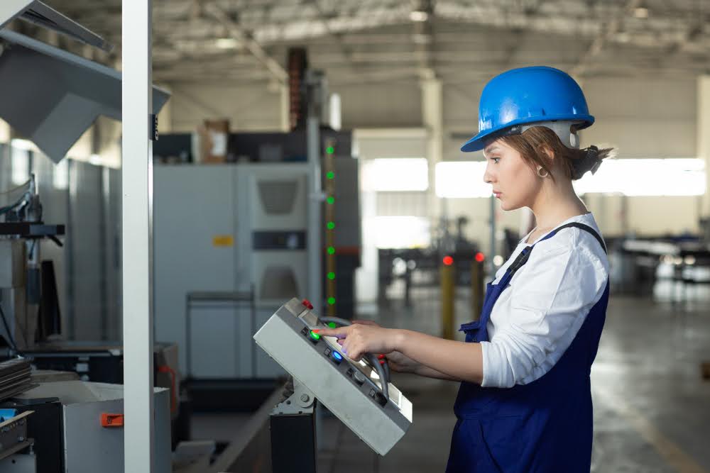 An engineer at the control panel, overseeing the use of custom machines for tube end forming.